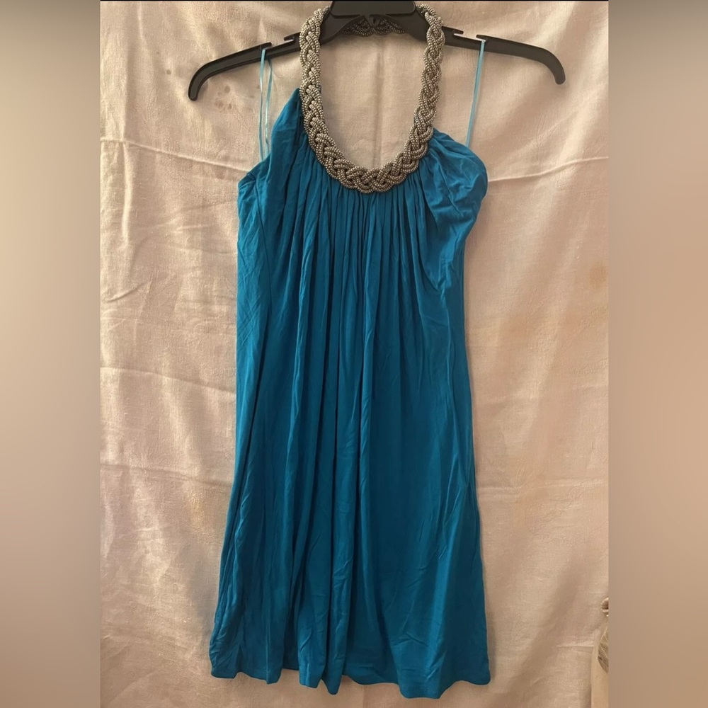 Gorgeous blue dress with chain design around the neck and open back
